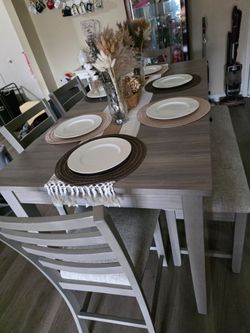 Table, chairs with bench