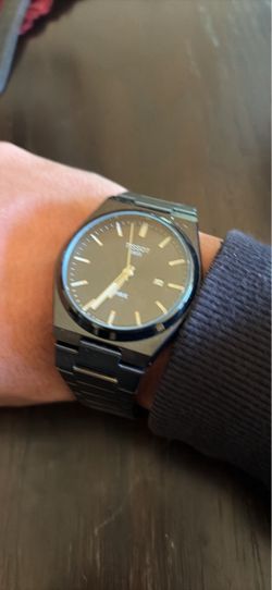 All black Tissot 1853 PRX wrist watch