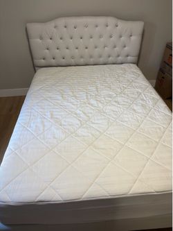 Queen sized bed frame with mattress