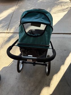 Green Jogging Stroller with Air-Filled Tires