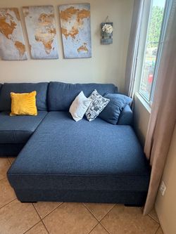 Beautiful dark blue sectional couch with extra wide chaise from Jerome’s