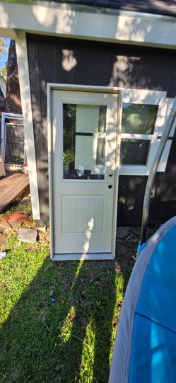 Back door 32x80 with external blinds . Framed , ready to install