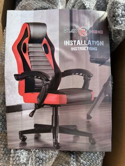 New purple and black, gaming chair, still in the box, actual color is in 4th picture 