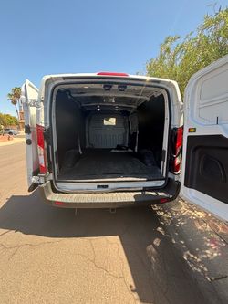 White Ford Transit Cargo Van
