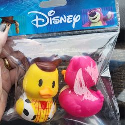 New in package Duckaloo Toy Story. Woody & Lotso rubber ducks.