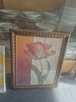 framed art print appears to be a "Red Door Tulip" by artist Pamela Gladding, featuring a floral design in a rustic brown wooden frame.