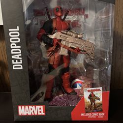 Deadpool collectible with comic book