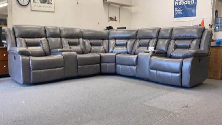 Leather recliner sectional sofa with 2 consoles