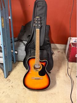 Mitchell Guitar with case and stand