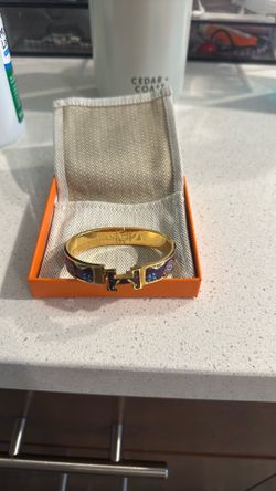 Real Hermes bracelet, only worn twice. Gold purple fun print