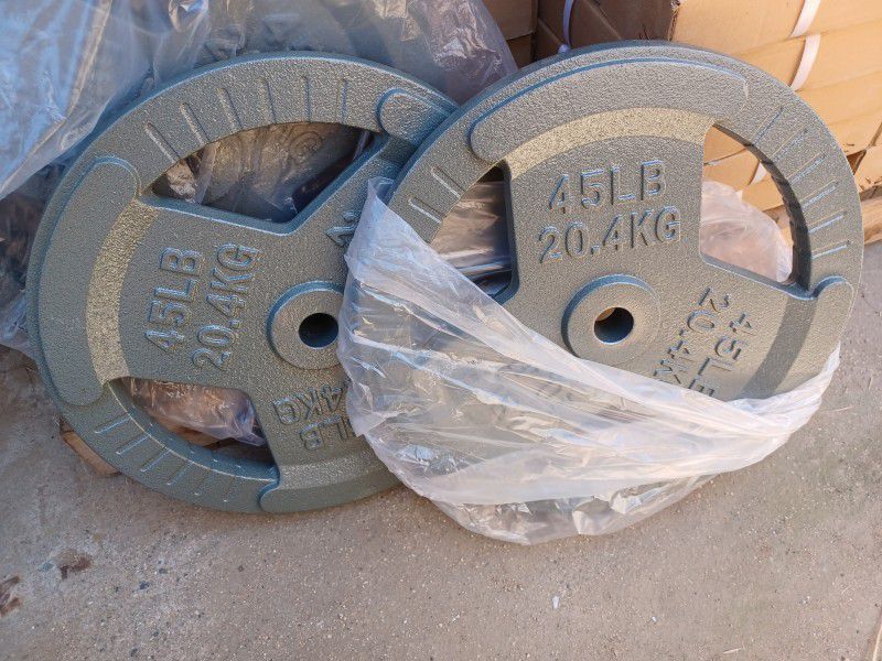 Standard one-inch weight plate pairs $1 per pound,  New 
