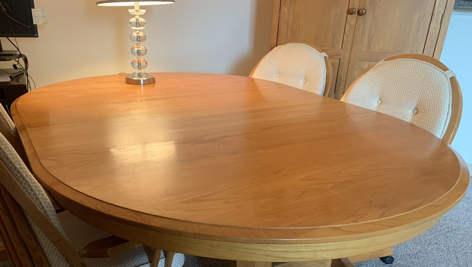 Oak table with Padded Swivel Wheeled Chairs
