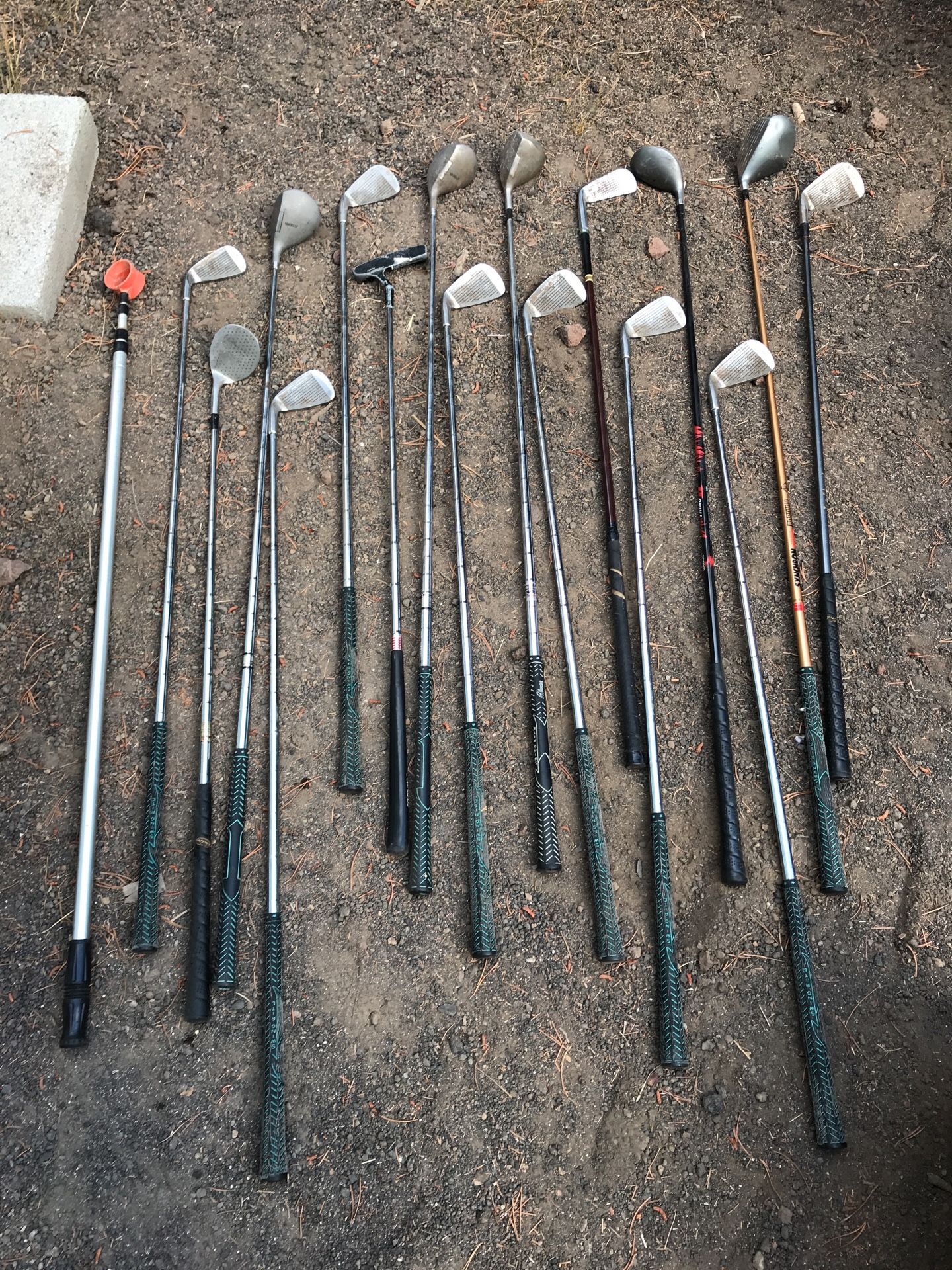 Assorted golf clubs