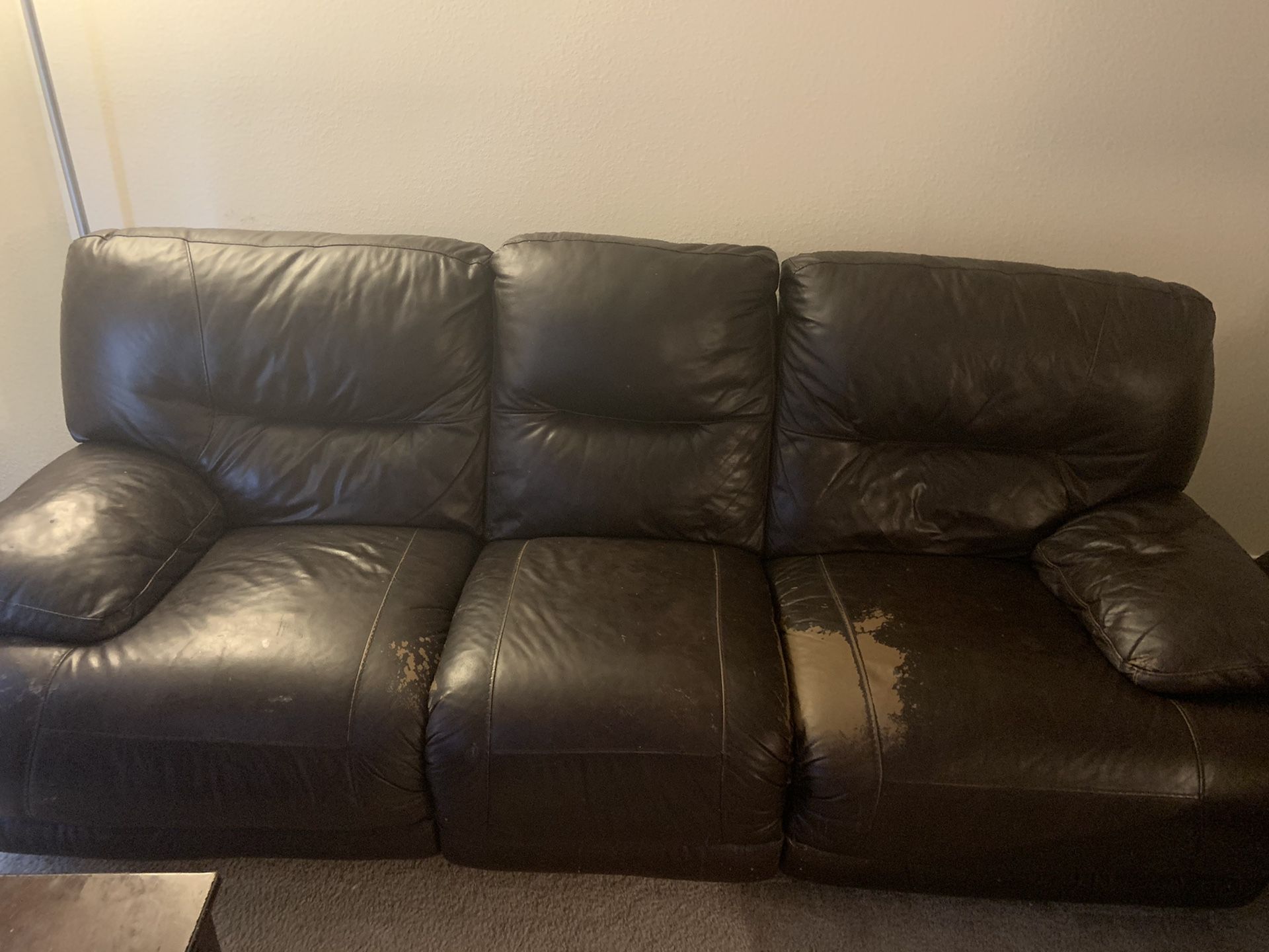 Sofa with recliner in Ok condition selling very reasonable
