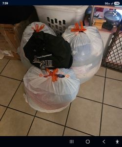 Lots of bags of clothes