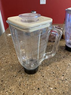 Two Oster Brand Blender Tops
