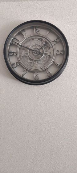 Better Homes & Gardens 20" Rustic Metal Arabic Moving Gear Analog Wall Clock featuring exposed central gears.