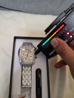 Iced Out Silver Skeleton Dial Watch
