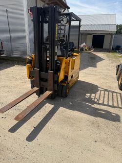 Drexel electric narrow aisle fork lift with charger.