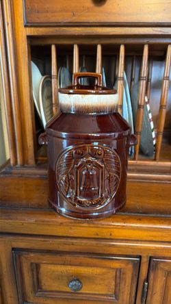 McCoy Pottery 1976 Bicentennial Liberty Bell Cookie Jar with the brown drip glaze.