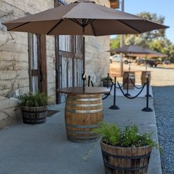 Wine Barrels Round Table Top And Umbrellas 