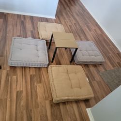 Floor seat pillows with table.