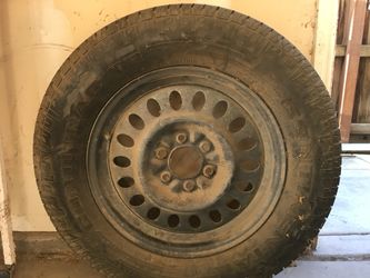 P245/65/R17 all terrain tire mounted on 6 hole Chevy rim