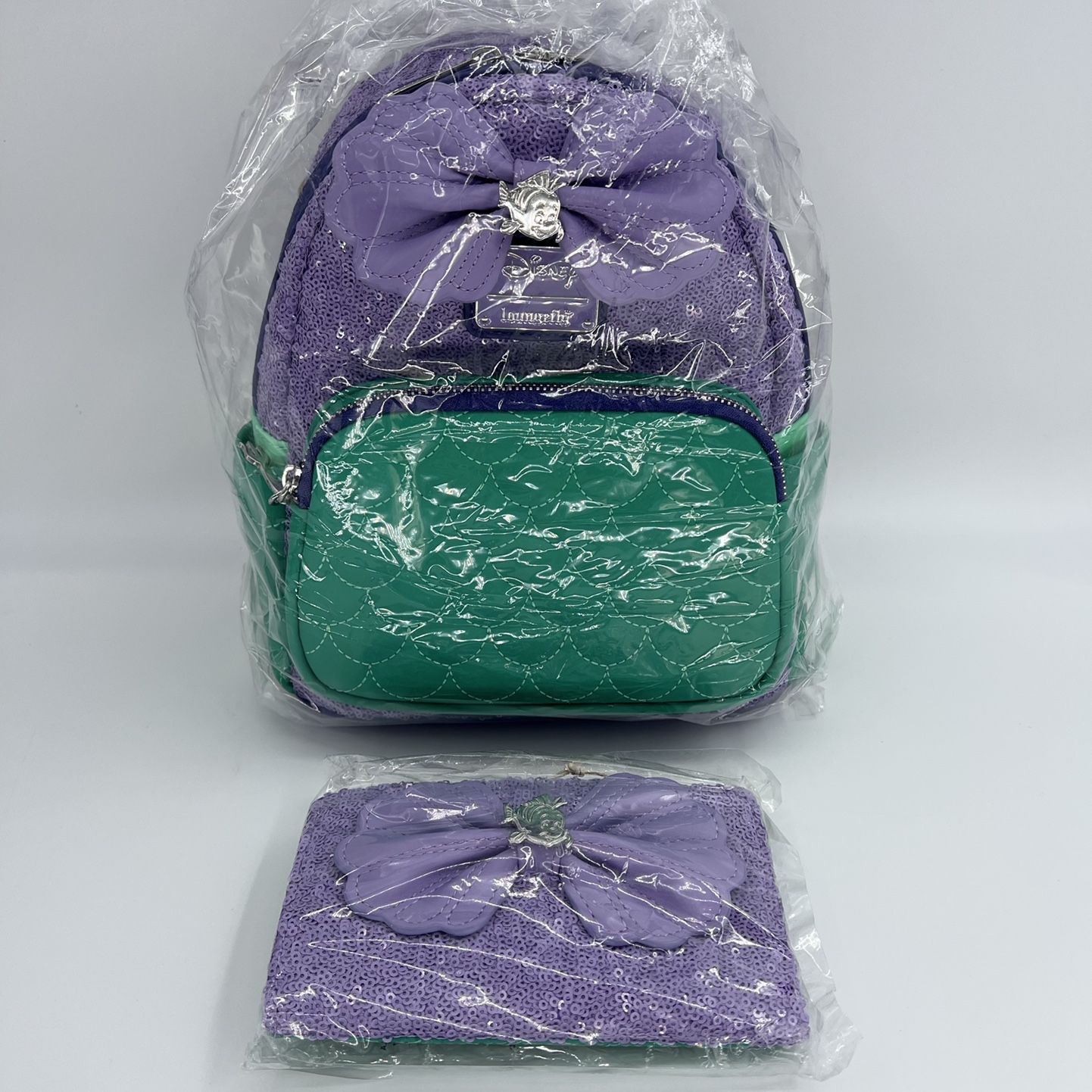 ariel sequin mini backpack by loungefly Exclusive - | Officially Licensed | Vegan Leather The exclusive Loungefly Disney Little Mermaid Ariel Princess Sequin Series Mini Backpack mimics Ariels classic mermaid look Disney Unboxing Little Mermaid Ariel