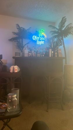 Full Bar With Corona Light , Two Sculptures And Two Bar Stools 