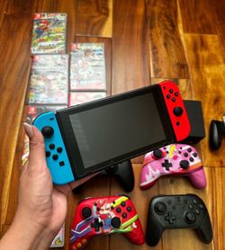 Nintendo switch with games and controllers