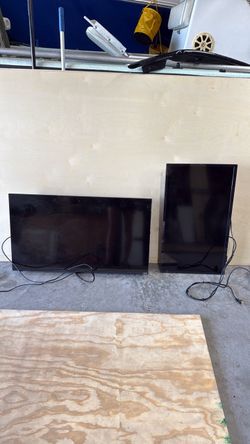 TWO 32 inch TVS WITH MOUNTS