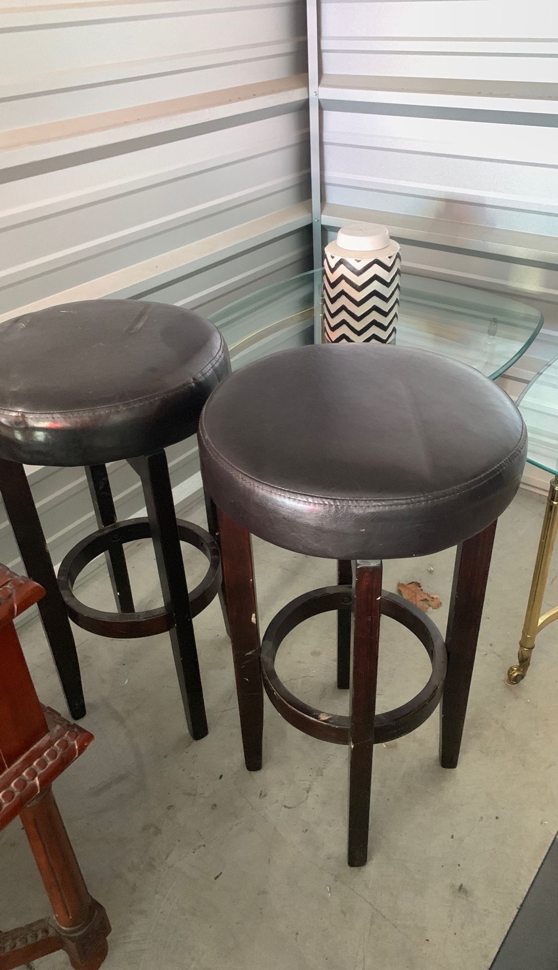 Bar stools some stuff on wood but easy fix no rips in leather