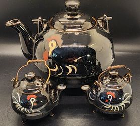 This is a vintage Japanese redware tea set, matching salt and pepper shakers