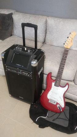 Stagg electric guitar with a guitar speaker system Bluetooth dvd karaoke and radio stations