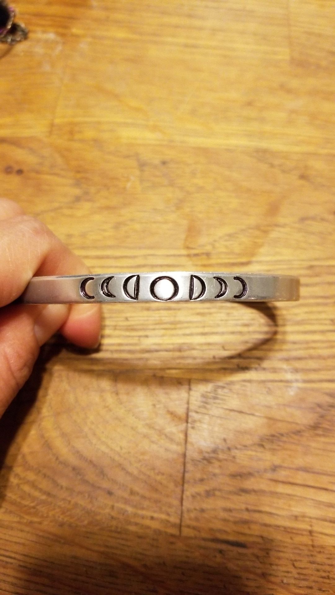 Hand hammered silver moon phase bracelet
