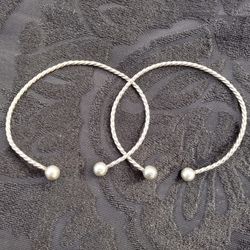 Two Silver Bangle Bracelets With Large Beaded Ends