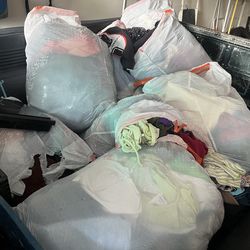 Bundle of clothes ( women’s , men , kids )