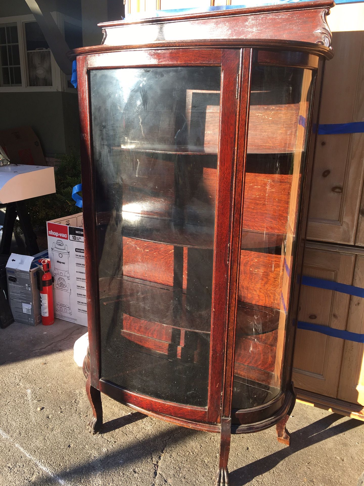 Antique Claw foot cabinet with Curved glass.