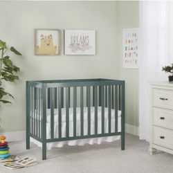 Green Mini Crib Never Used