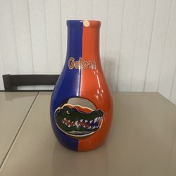 Florida Gators UF Florida Vintage Ceramic Candle Luminary Candle Holder 12in. Used in good condition with cosmetic blemishes. The two major blemishes 