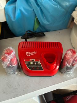Milwaukee m12 charger and (2) 2 amp batteries new