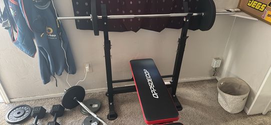 Lots of weight, curling bar, straight bar, and bench