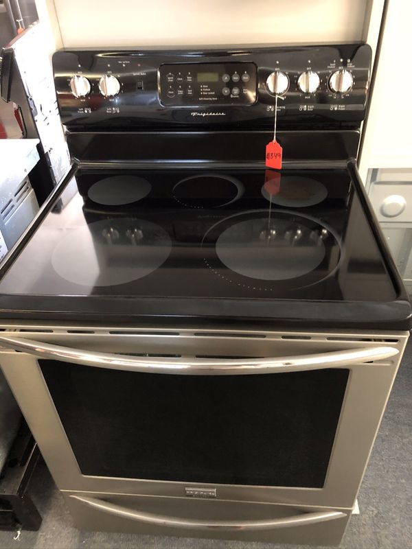 Used Frigidaire Gallery 5 burner glass top range. 1 year warranty for