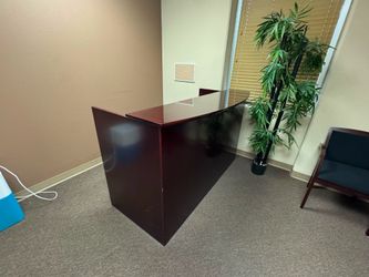 Reception desk and waiting area table and chairs