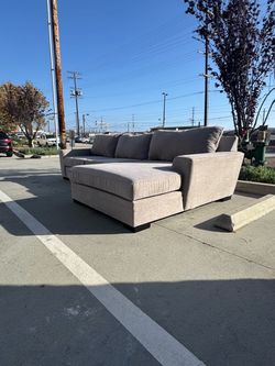Grey living spaces sectional sofa- delivery available