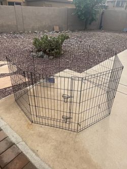 Brand new dog play pen with a door. 30”x24”. 8 panels. Great quality!