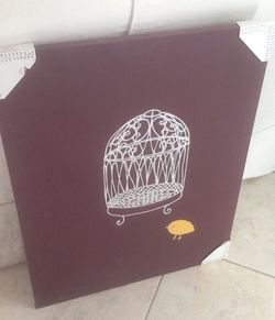 Cute yellow bird with birdcage