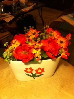 Flower vase filled with orange flowers
