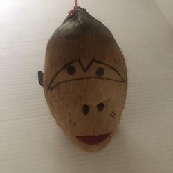 Coconut, carved monkey face, tiki bar decor