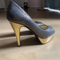 Gold and Black High Heels with a textured design.